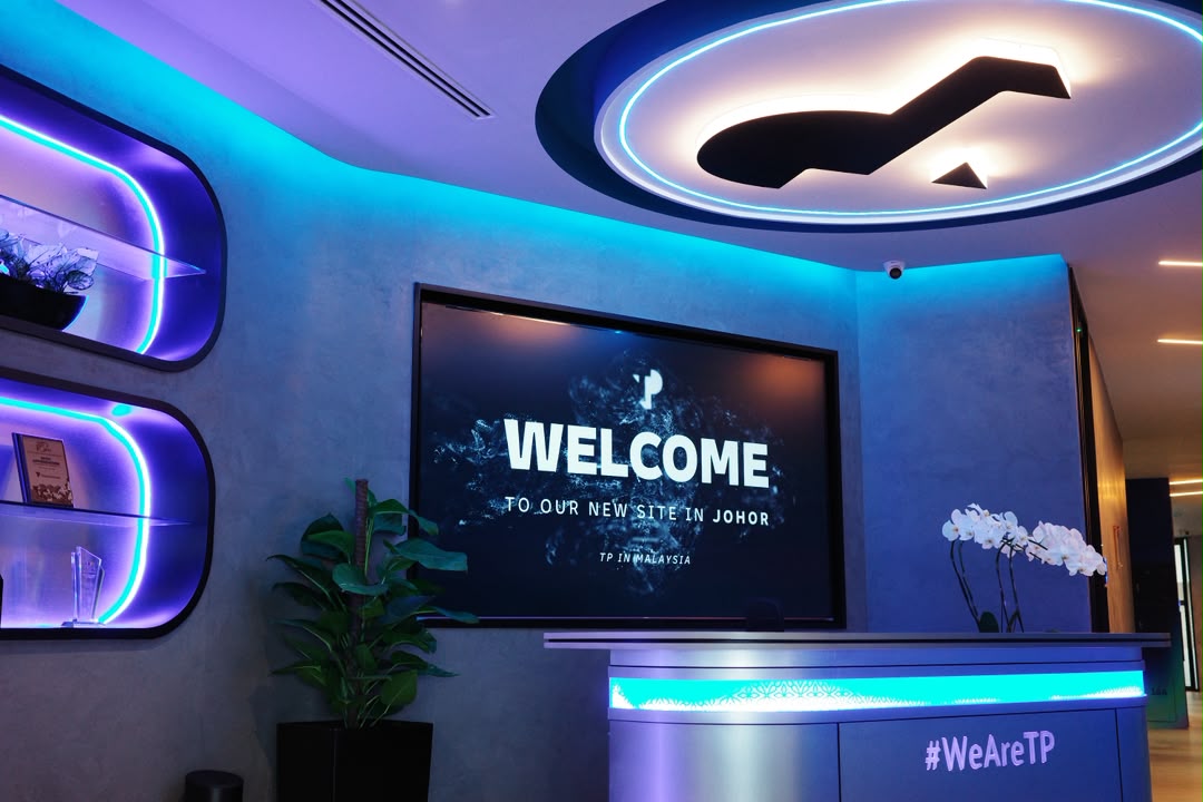 Modern reception area at the new TP Johor Bahru operations centre featuring a digital welcome screen