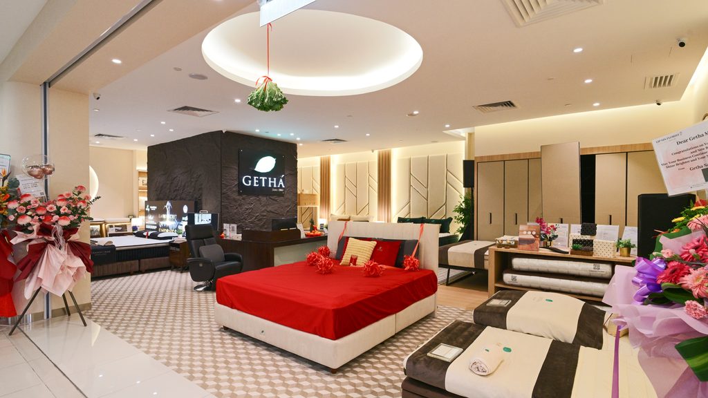 Getha wedding mattress collection displayed with red bedsheets at the official showroom